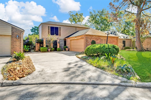 view of front of home with a garage and a front yard