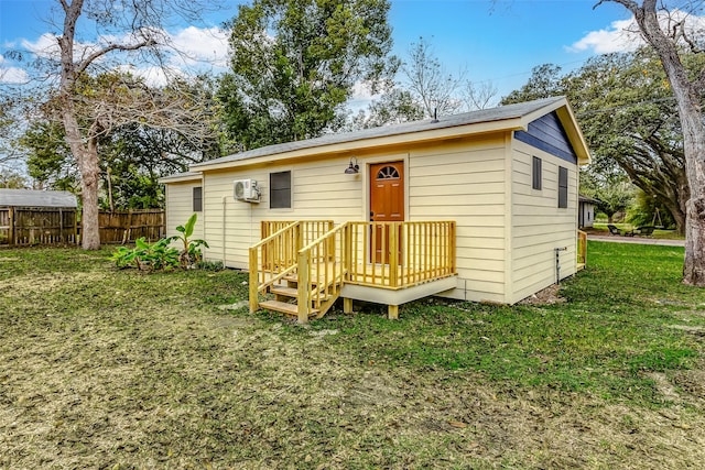 rear view of property with a lawn