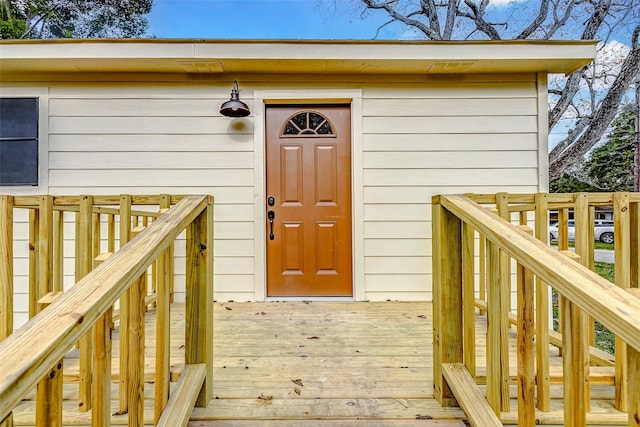 entrance to property with a deck