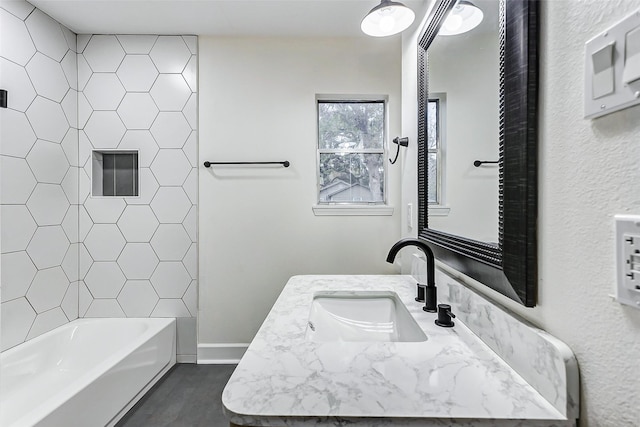 bathroom featuring vanity and shower / bath combination