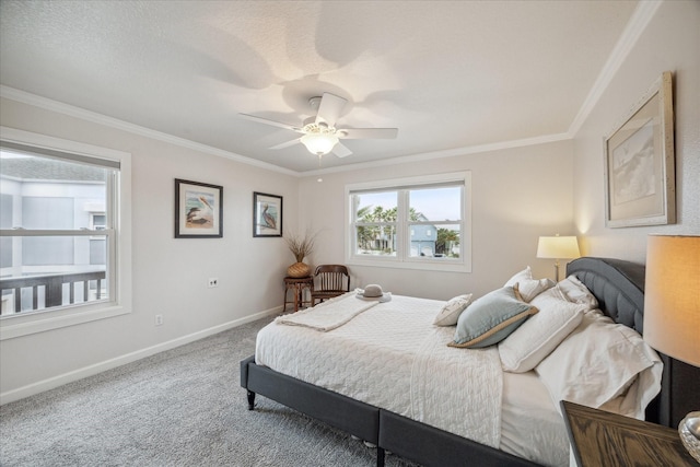 carpeted bedroom featuring a textured ceiling, ceiling fan, and crown molding