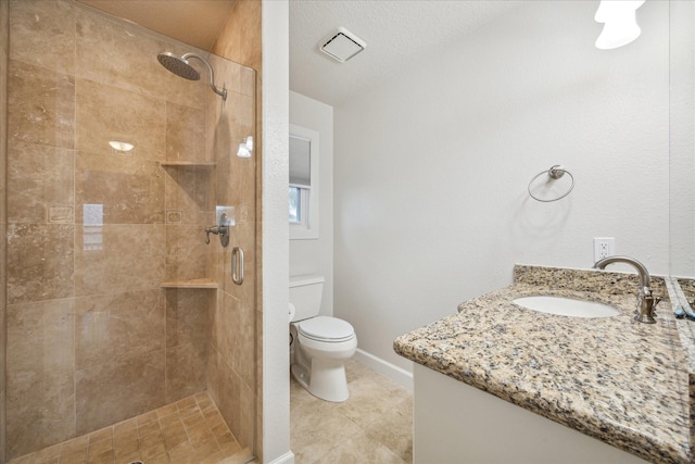 bathroom with walk in shower, tile patterned floors, a textured ceiling, toilet, and vanity