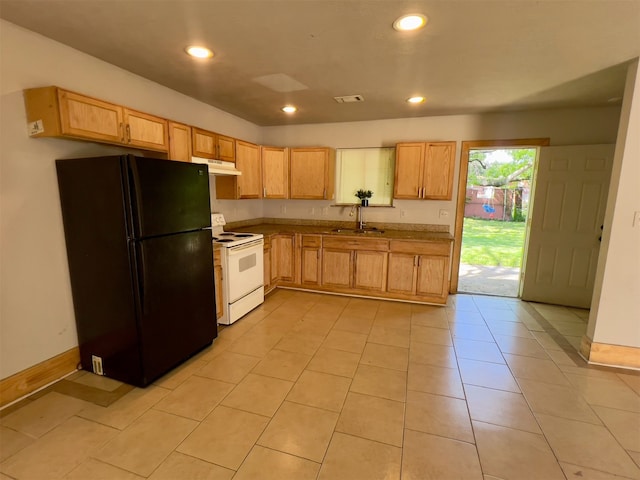 kitchen featuring black fridge, sink, electric range, light brown cabinetry, and light tile patterned flooring