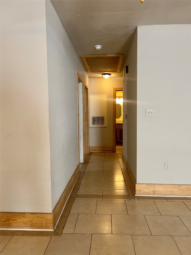 corridor with light tile patterned floors