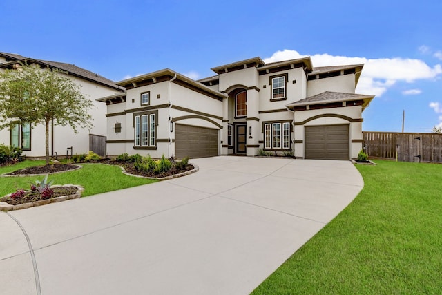 mediterranean / spanish house with a front lawn and a garage