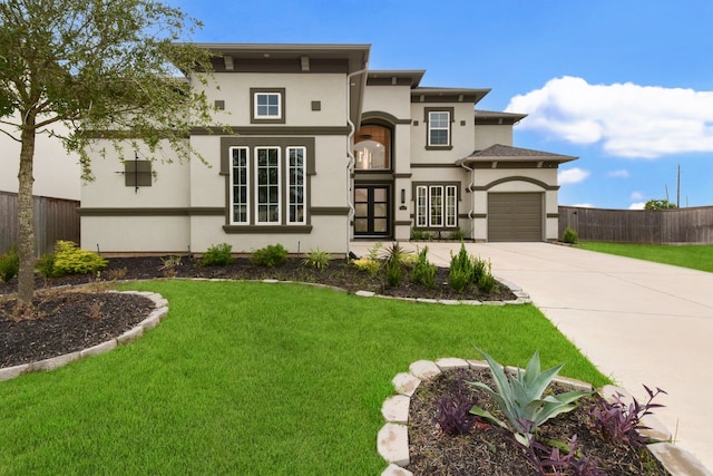 view of front of property featuring a front yard and french doors