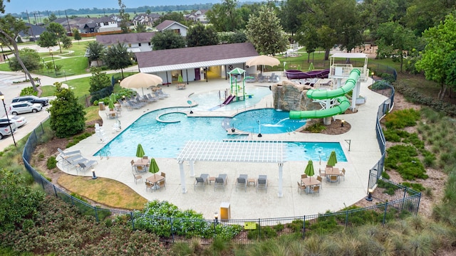 view of swimming pool with a water slide