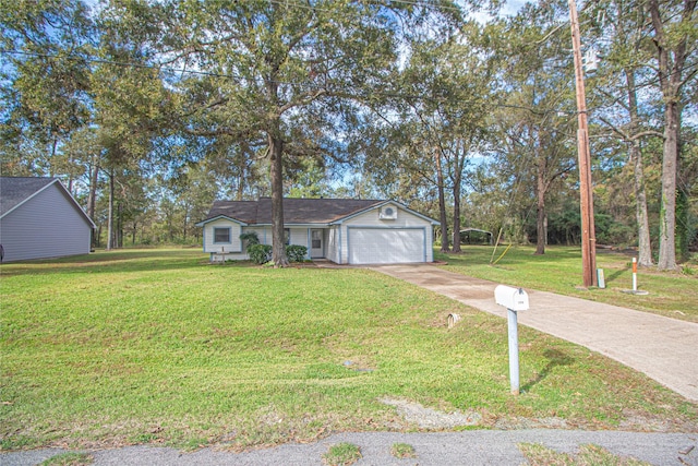 single story home featuring a garage, driveway, and a front yard