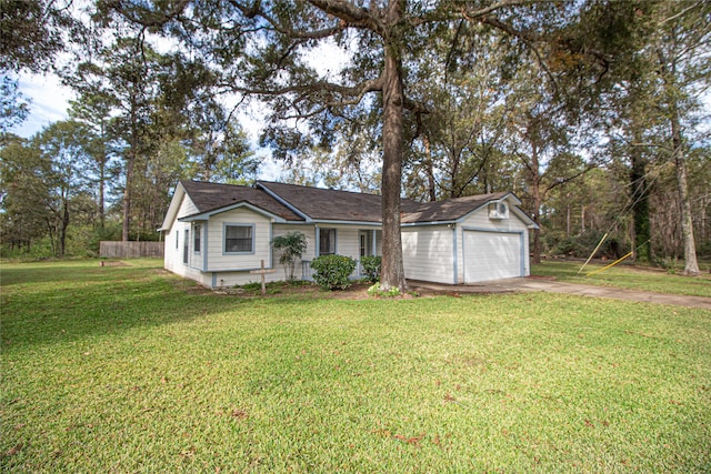 ranch-style home with a garage, driveway, and a front yard