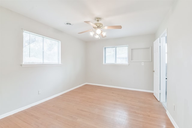 unfurnished room featuring light hardwood / wood-style flooring and ceiling fan