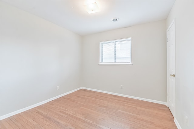 unfurnished room featuring light hardwood / wood-style flooring