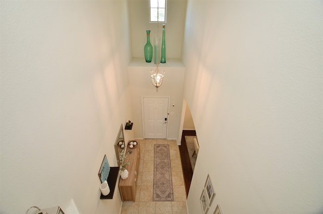 doorway with light tile patterned floors