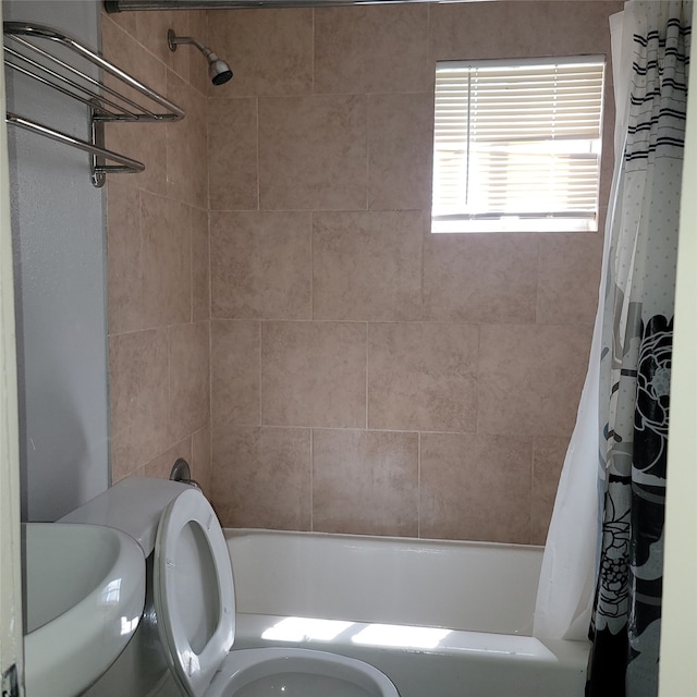 bathroom with toilet and shower / bathtub combination with curtain