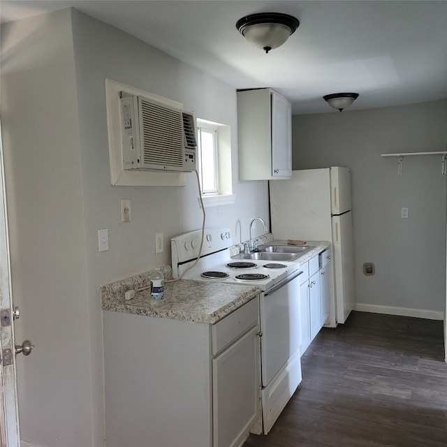 kitchen featuring a wall mounted air conditioner, white appliances, white cabinets, sink, and dark hardwood / wood-style floors