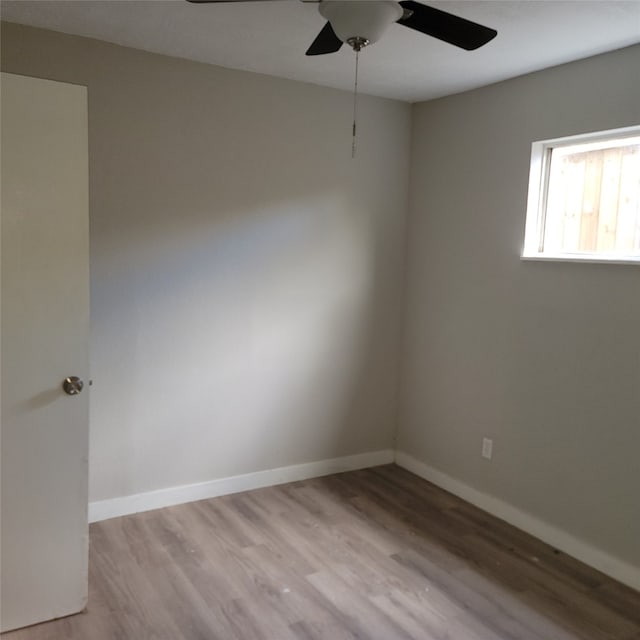 unfurnished room featuring ceiling fan and light wood-type flooring