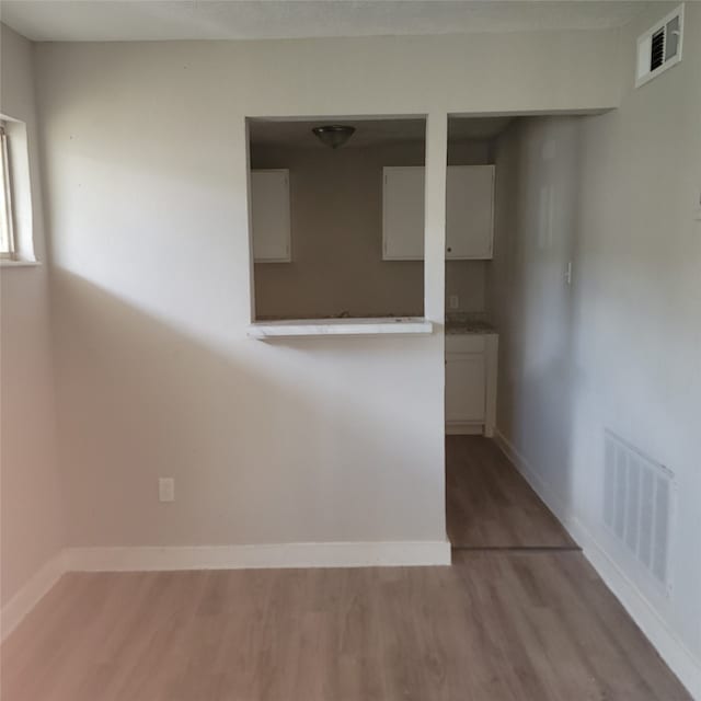 spare room featuring light hardwood / wood-style floors