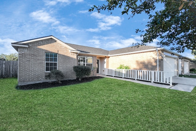 view of front of home with a garage and a front lawn