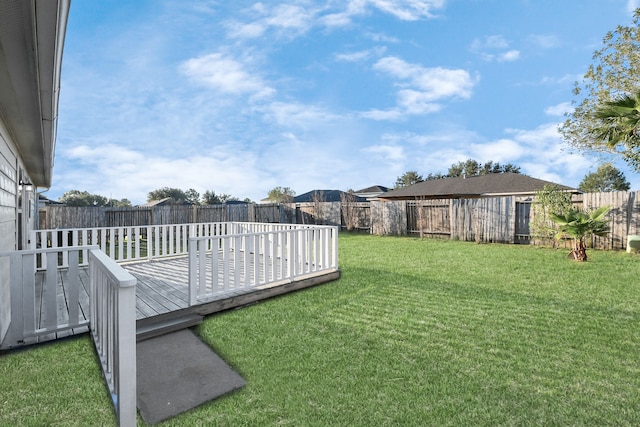 view of yard with a wooden deck