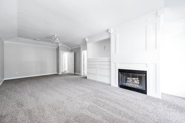 unfurnished living room featuring carpet flooring, ornamental molding, and vaulted ceiling