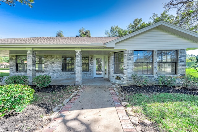 single story home featuring a porch