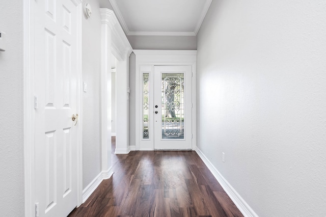 doorway to outside with crown molding and dark hardwood / wood-style floors