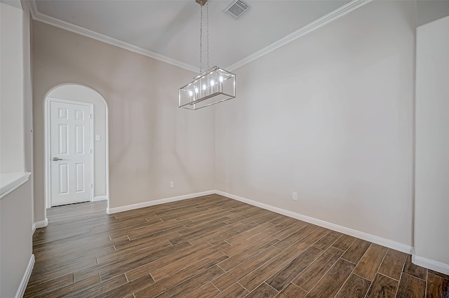 interior space featuring a chandelier, dark hardwood / wood-style floors, and crown molding