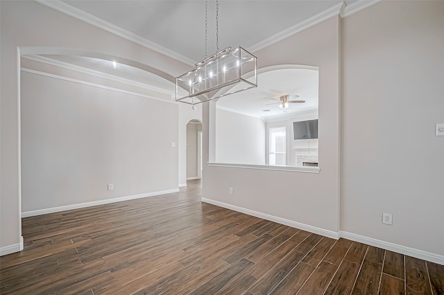 spare room featuring ceiling fan, dark hardwood / wood-style flooring, and ornamental molding