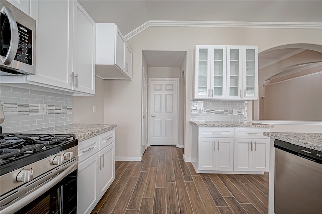 kitchen with white cabinets and appliances with stainless steel finishes