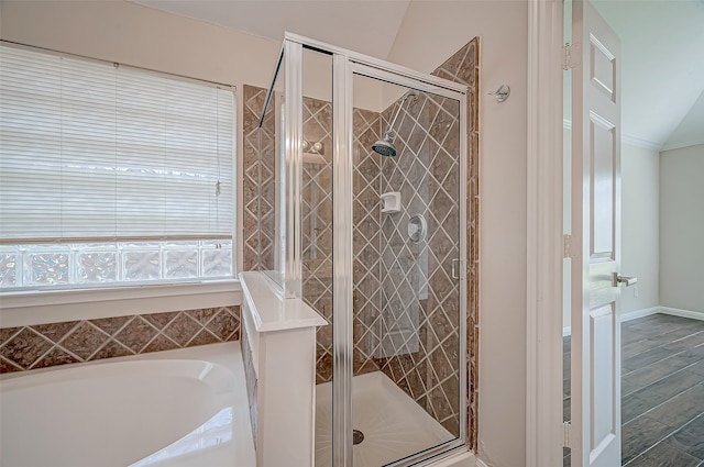 bathroom featuring plus walk in shower and vaulted ceiling