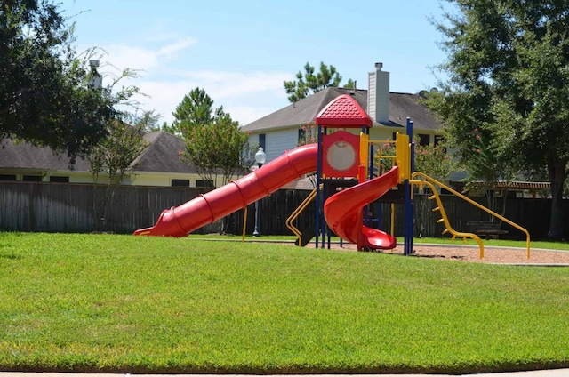 view of play area featuring a lawn