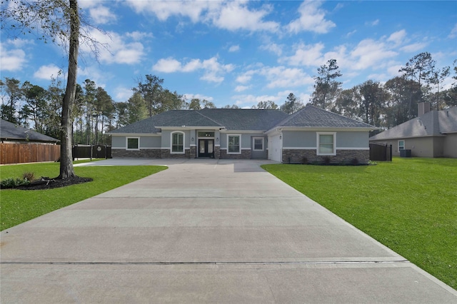 single story home featuring a front lawn