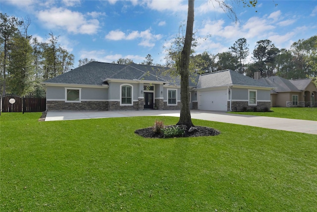 single story home with a front yard and a garage