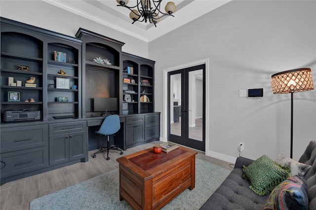 office featuring high vaulted ceiling, french doors, crown molding, light wood-type flooring, and a chandelier