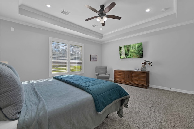 bedroom featuring carpet, ceiling fan, a raised ceiling, and crown molding