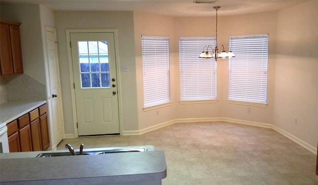 entryway featuring an inviting chandelier