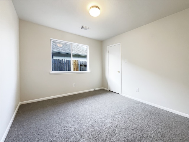 unfurnished room featuring carpet