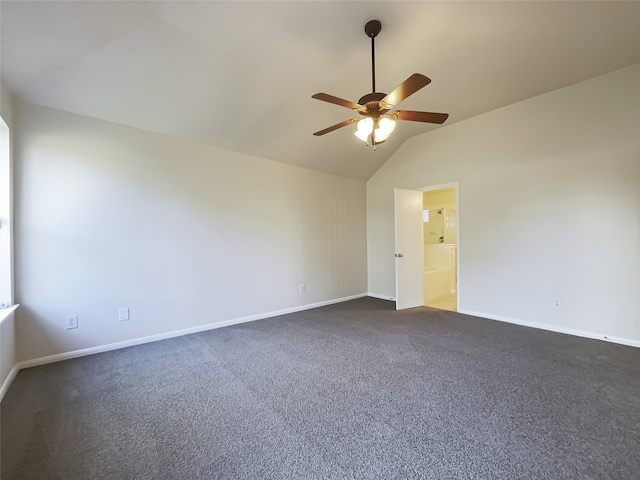 carpeted spare room with ceiling fan and vaulted ceiling