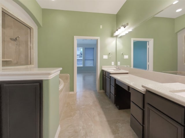 bathroom with shower with separate bathtub and vanity