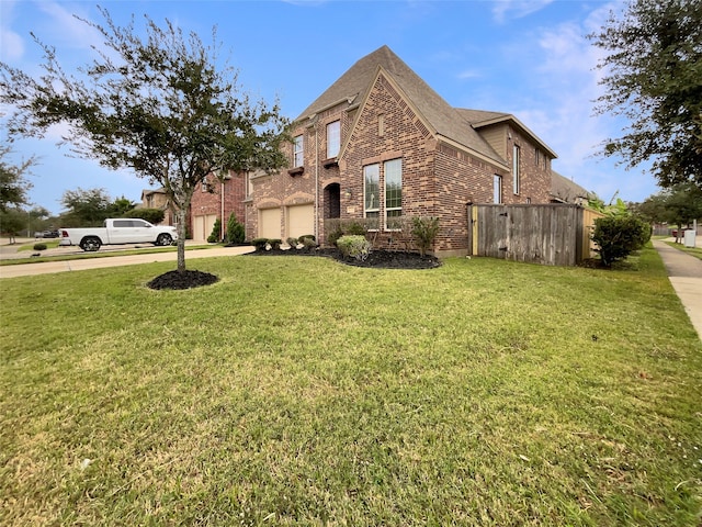 view of side of property with a lawn and a garage