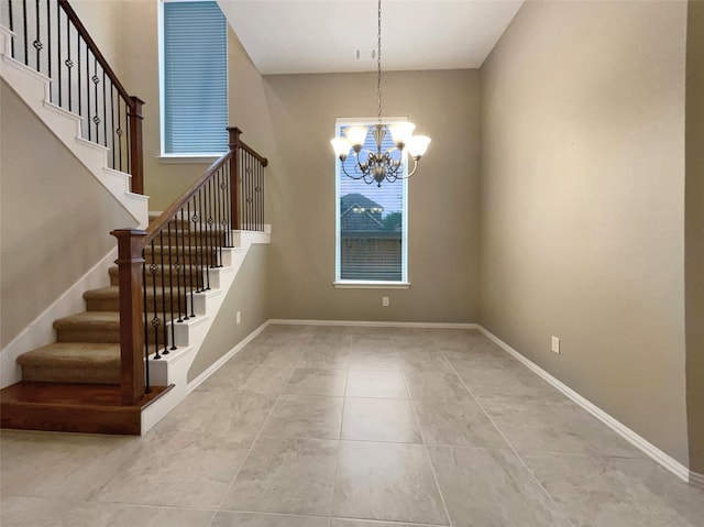 interior space featuring tile patterned floors and an inviting chandelier