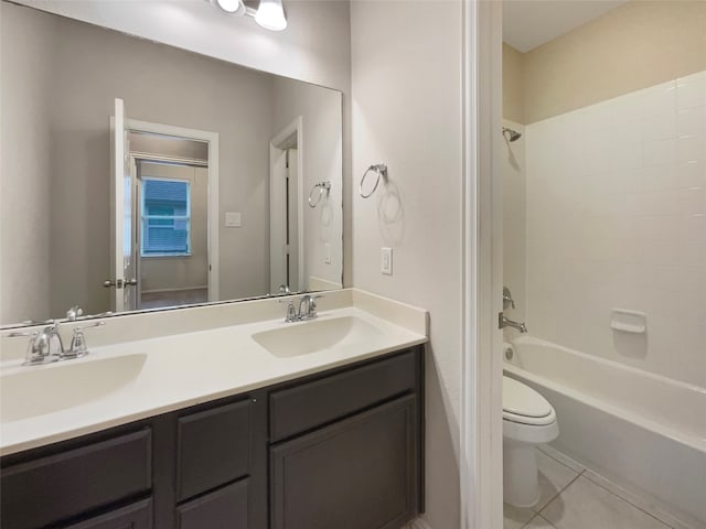 full bathroom featuring tile patterned floors, vanity,  shower combination, and toilet