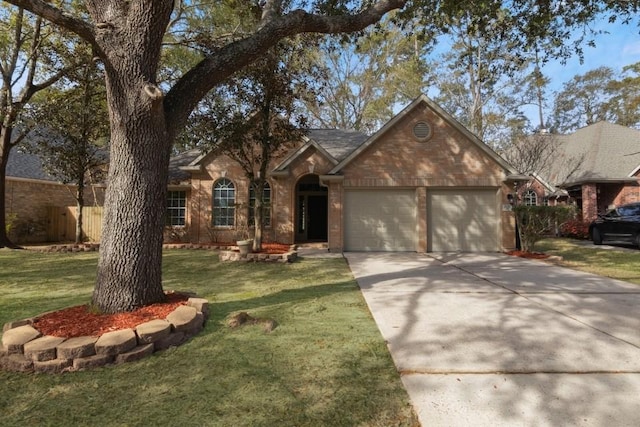 single story home featuring a front lawn and a garage