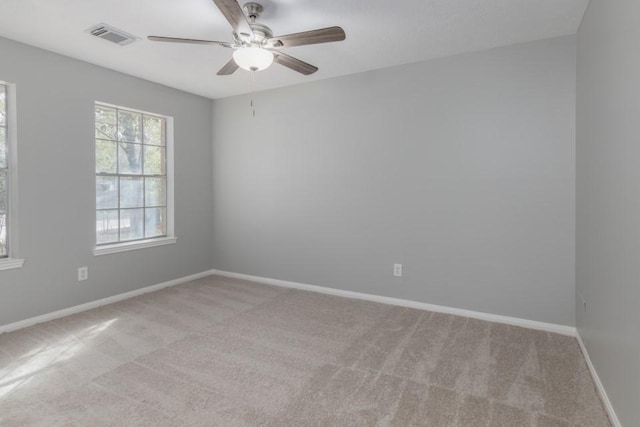 carpeted empty room featuring ceiling fan