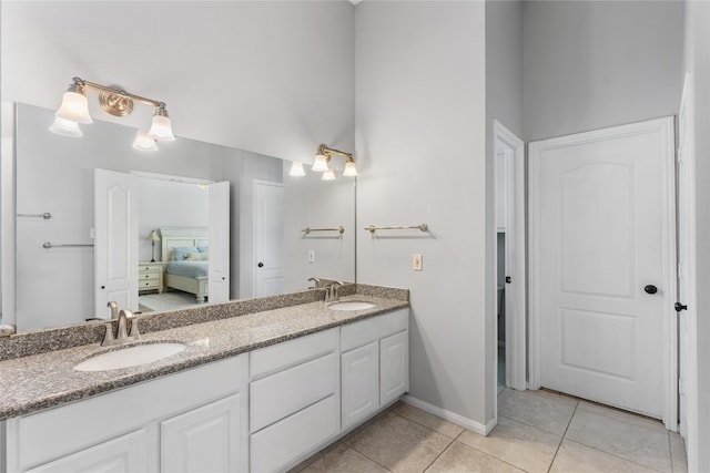 bathroom with tile patterned floors and vanity