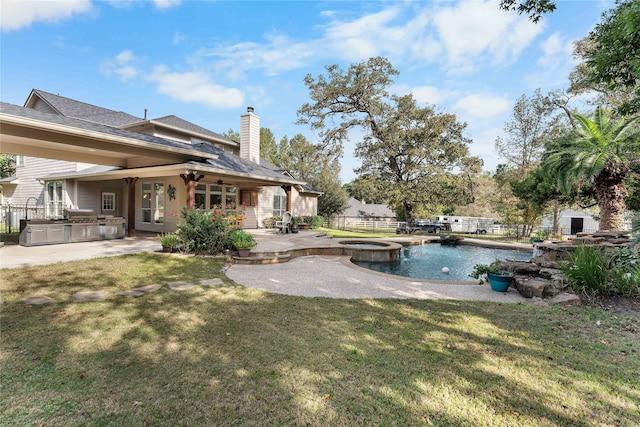 view of yard with a pool with connected hot tub, area for grilling, a patio area, ceiling fan, and a fenced backyard