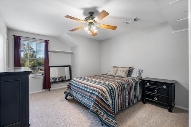 bedroom featuring a ceiling fan, light colored carpet, visible vents, and baseboards