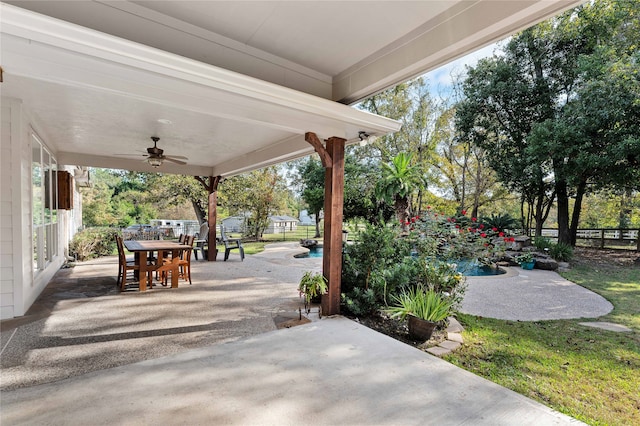 view of patio with an outdoor pool, ceiling fan, a fenced backyard, and outdoor dining area