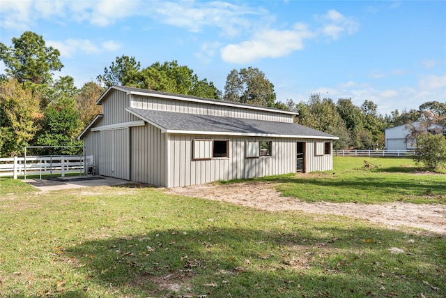 view of outbuilding with a lawn