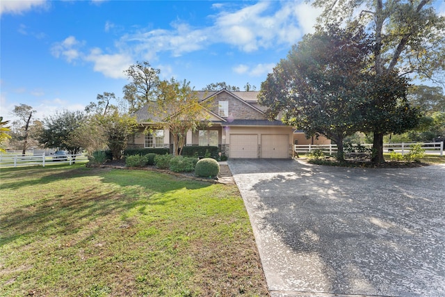 obstructed view of property featuring a front lawn and a garage