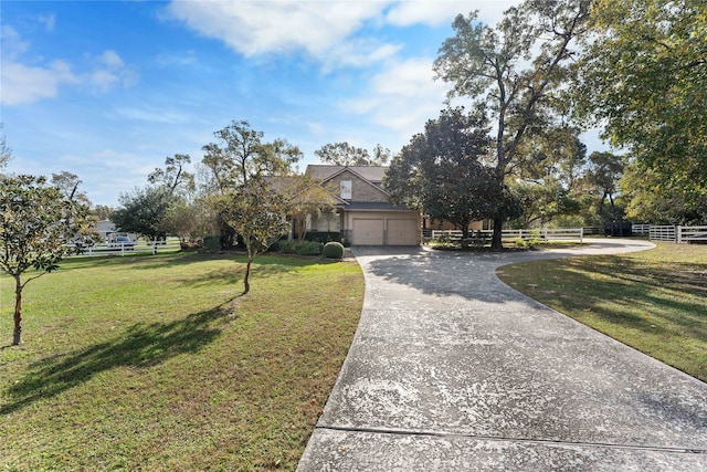 view of front facade featuring a front yard and a garage